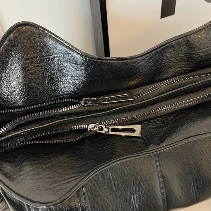Sac femme élégant en cuir synthétique, bandoulière versatile, adapté à toutes les occasions.