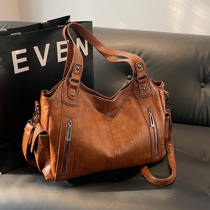 Sac bandoulière femme pratique, cuir synthétique résistant, idéal pour les essentiels quotidiens.