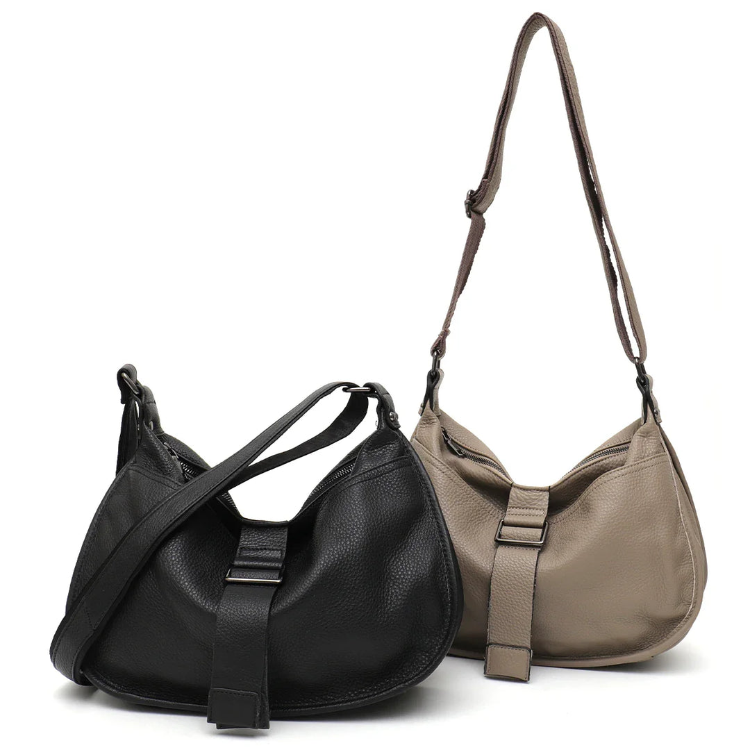 Sac bandoulière femme chic en similicuir gris, alliant élégance et fonctionnalité pour toutes les occasions.