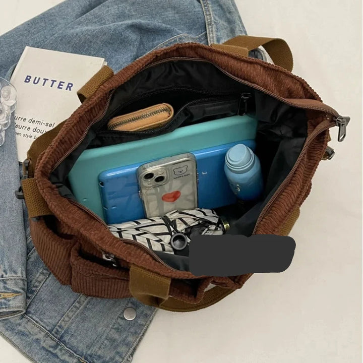 Sac femme élégant en velours côtelé, bandoulière ajustable. Sac à main pratique pour vos essentiels.