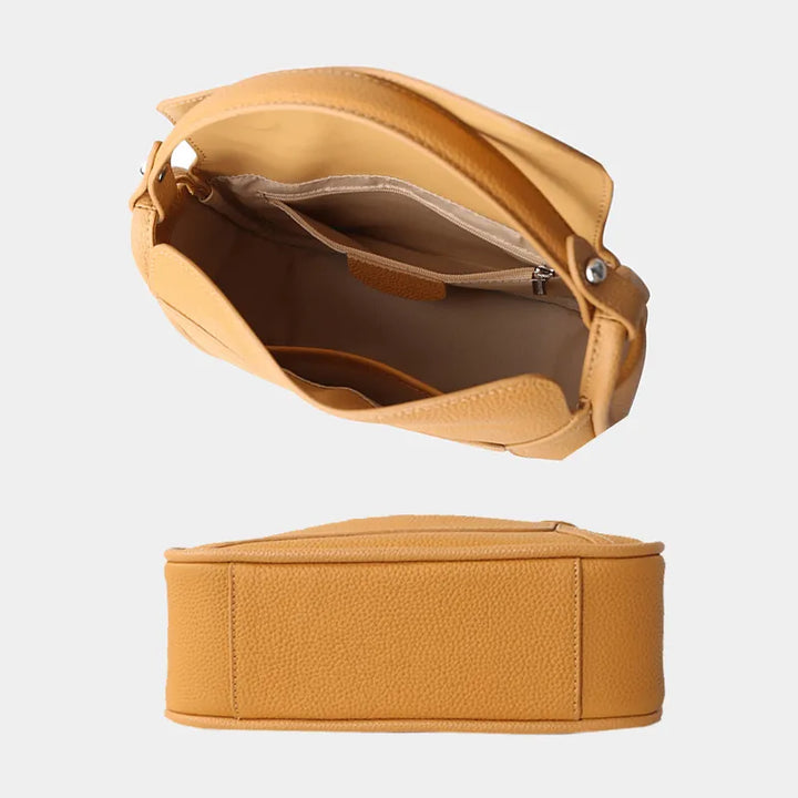 Sac bandoulière femme en cuir noir, élégant et pratique, un classique de la maroquinerie.