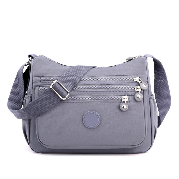 Sac bandoulière femme confortable et très organisé, simplifiant votre quotidien avec style.