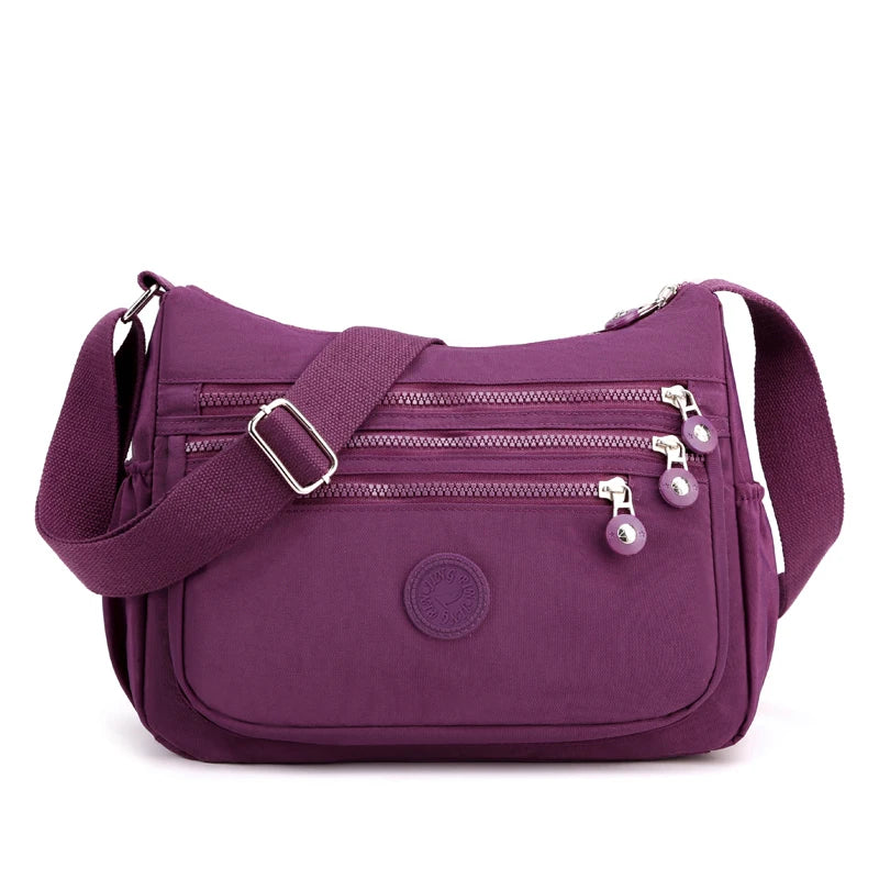 Sac bandoulière femme multipoches offrant une organisation intelligente pour tous vos essentiels.