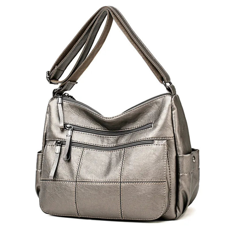 Sac à bandoulière femme Nexis en similicuir, couleur unie, style hobo élégant et pratique.