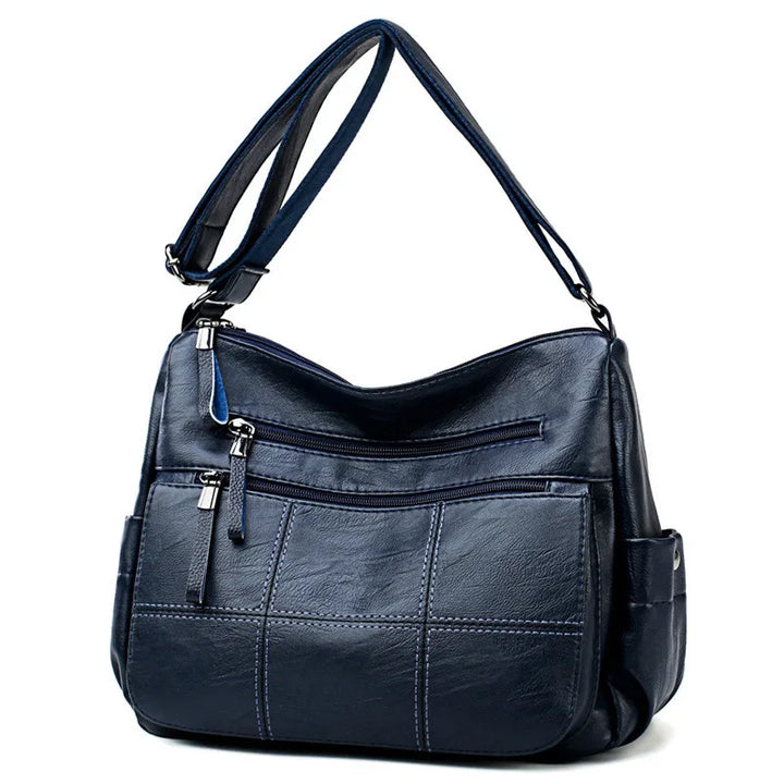 Vue intérieure du sac hobo Nexis, doublure textile, multiples poches pour une organisation facile.