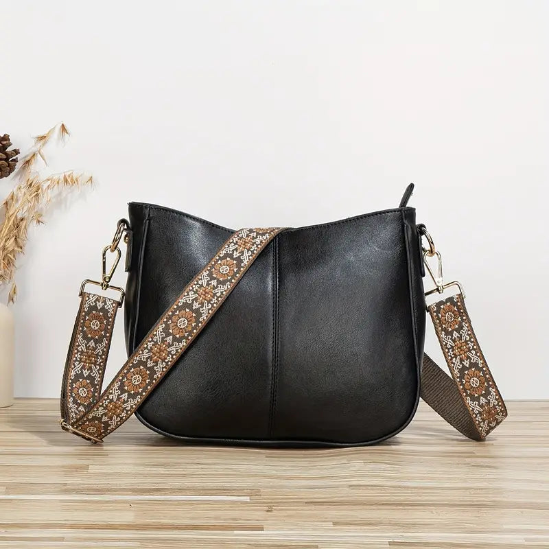 Sac bandoulière ajustable pour femme, en cuir végétalien, confort et style au quotidien.