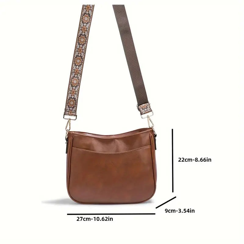 Sac bandoulière femme élégant en cuir vegan, avec compartiments intérieurs pratiques.