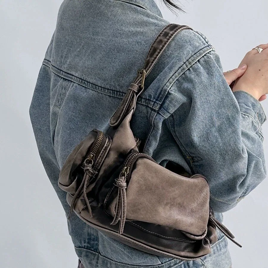 Sac bandoulière femme vintage effet délavé. Élégant et pratique pour le quotidien.