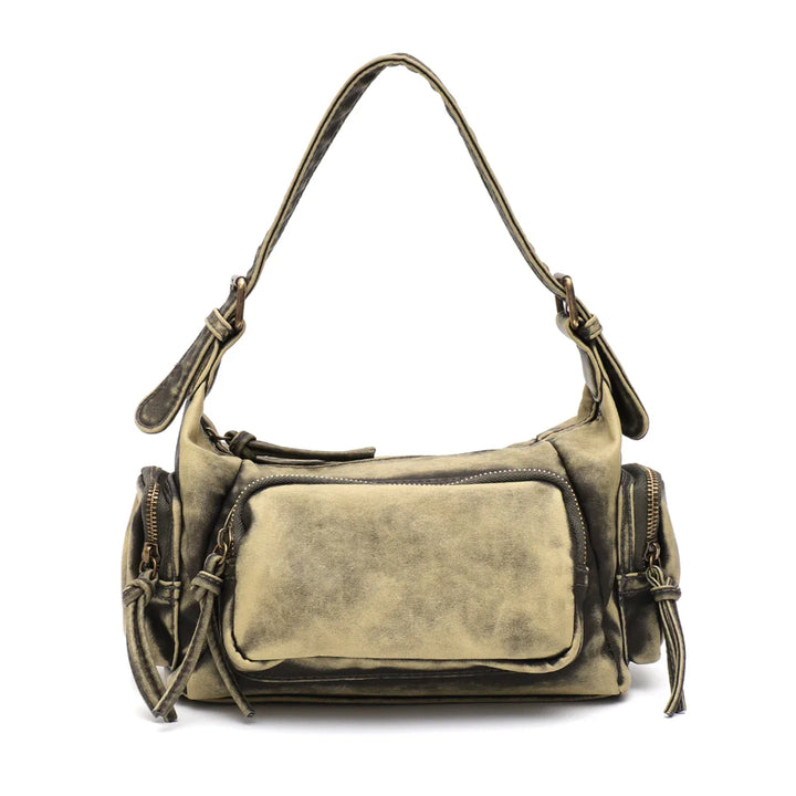 Sac à épaule femme style vintage délavé. Robuste et chic, parfait pour toute tenue.
