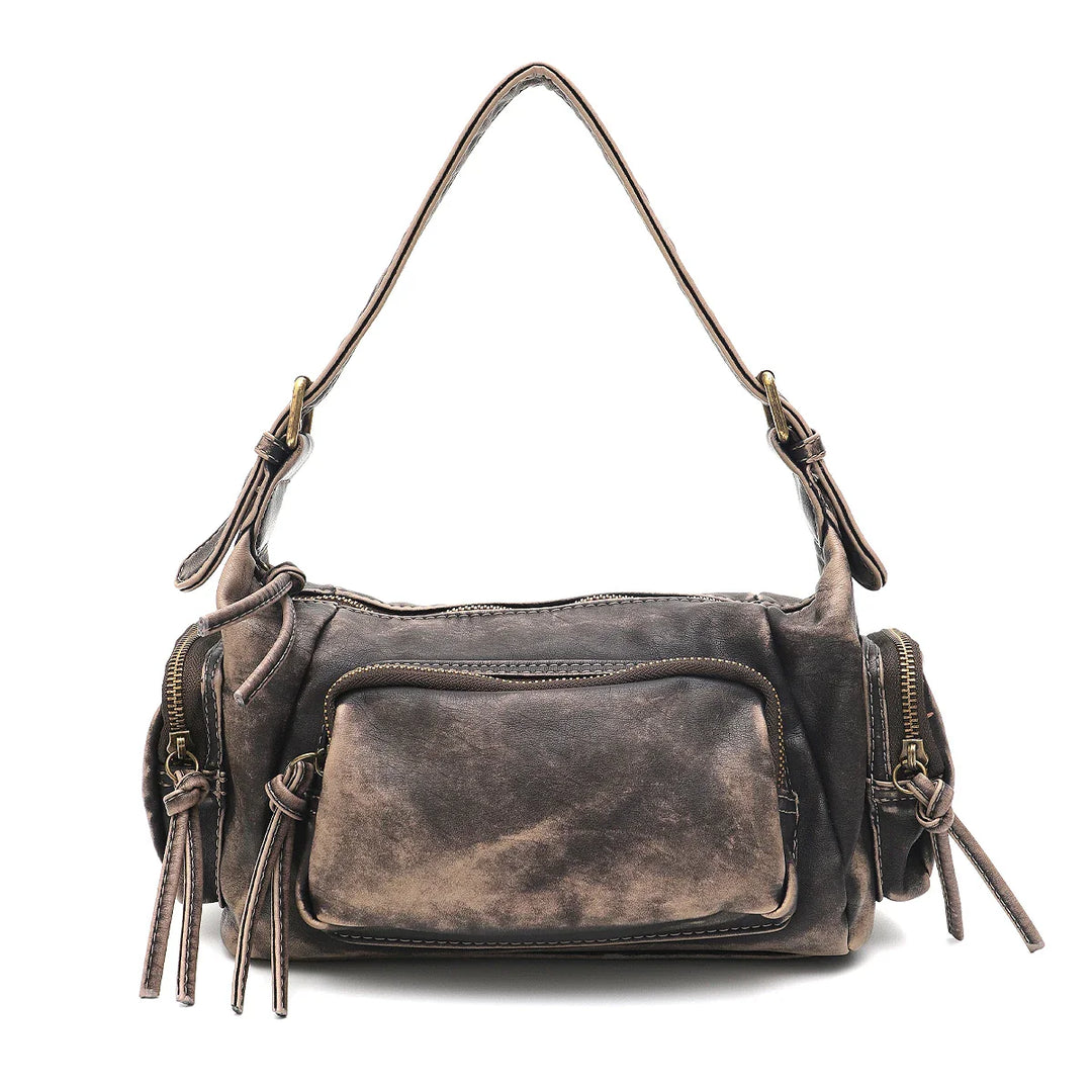 Sac femme avec effet délavé vintage, plusieurs poches zippées. Très pratique.