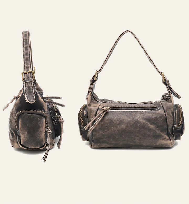 Sac femme délavé, look rétro-chic. Peut être porté à l'épaule ou en bandoulière.