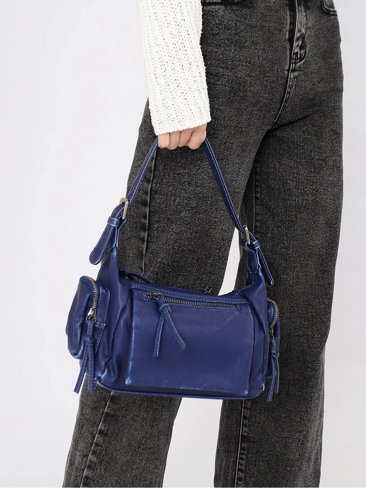 Sac bandoulière femme en similicuir vieilli, effet délavé. Tendance vintage affirmée.