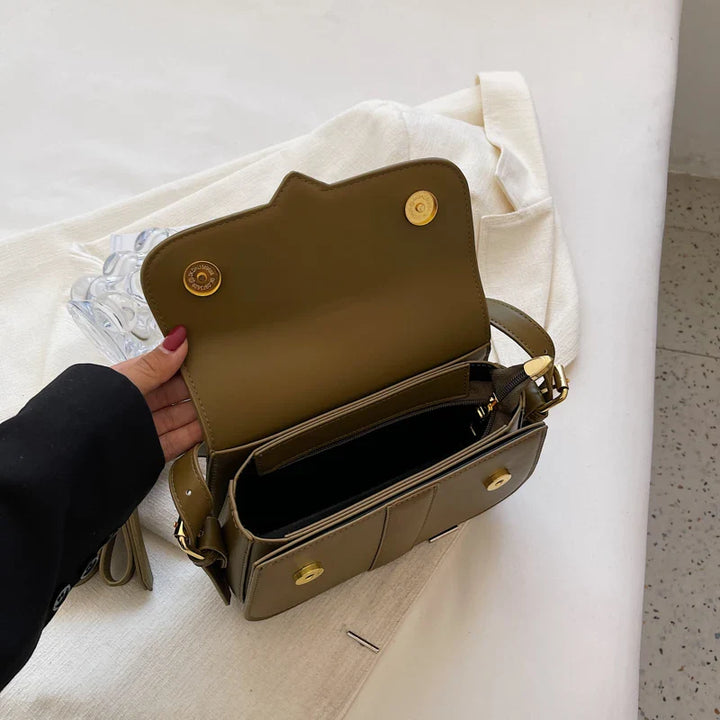 Sac bandoulière kaki élégant avec reflets, idéal pour un look sophistiqué
