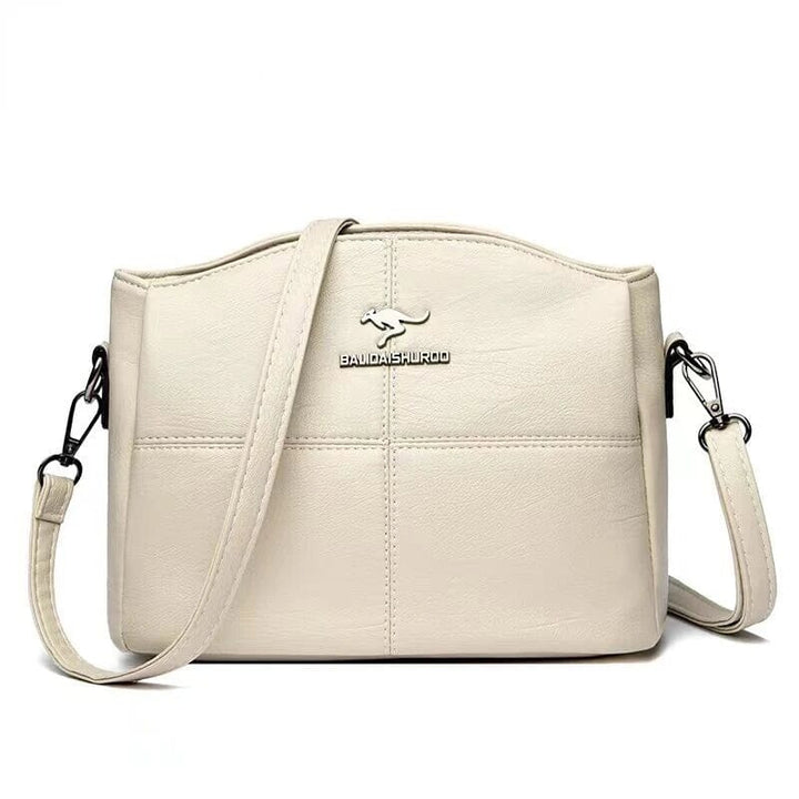 Sac bandoulière femme, design moderne et raffiné en cuir. L'accessoire féminin par excellence.