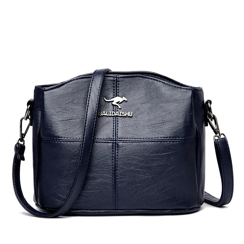 Sac femme en cuir grainé, style bandoulière, idéal pour une allure décontractée ou habillée.