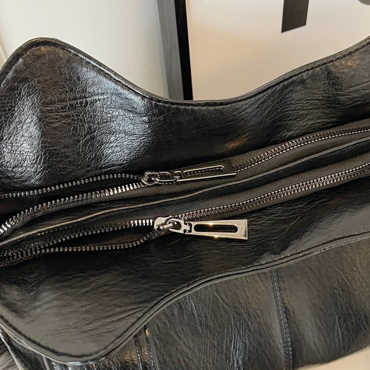 Sac à bandoulière femme, cuir végétal, élégant et moderne, parfait pour un look chic.