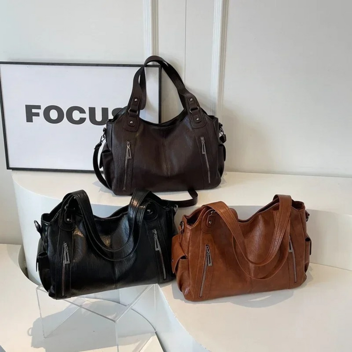 Sac élégant pour femme, style mode en cuir végétal, bandoulière ajustable, très utile.