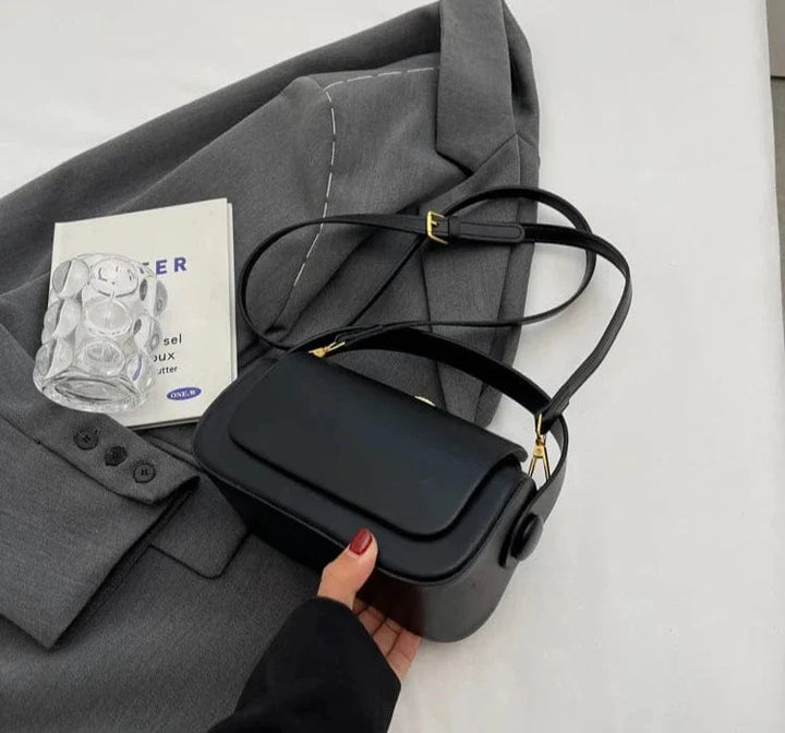 Sac à main femme noir en cuir PU, accessoire polyvalent pour toutes les occasions.