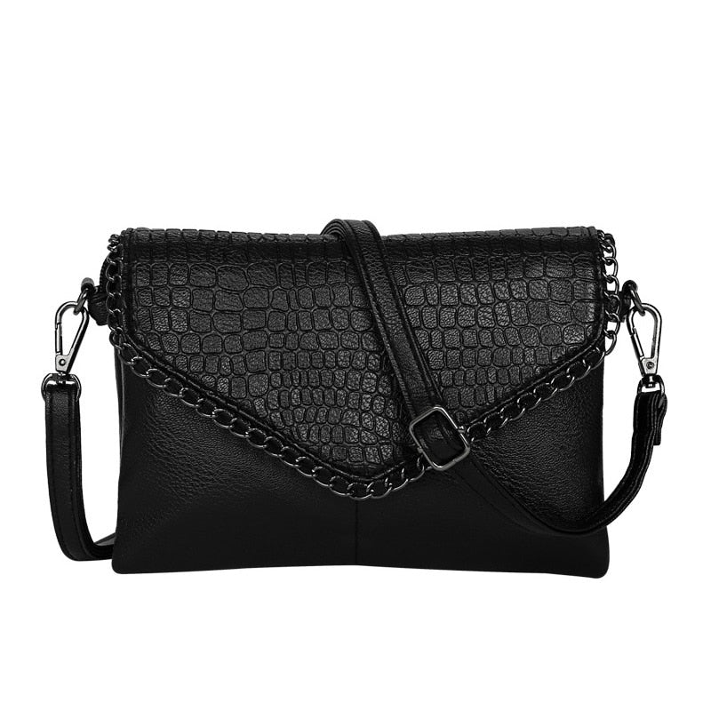 Sac bandoulière élégant noir effet croco pour femme, en cuir végan.