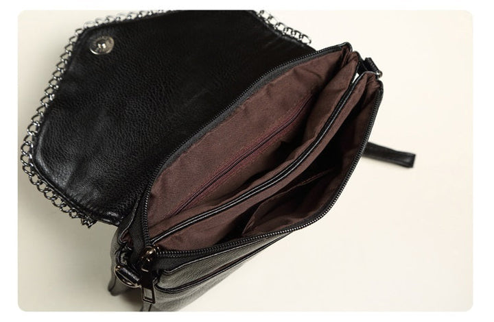 Sac à main bandoulière noir effet croco pour femme, design moderne et polyvalent.