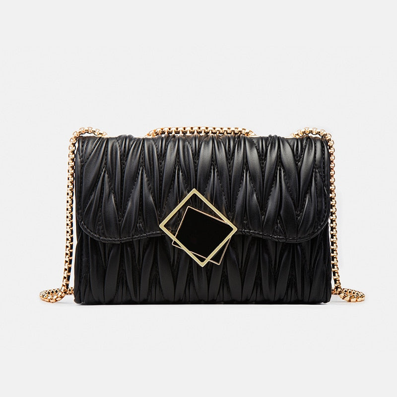 Pochette femme chic noir et doré. Sac élégant en cuir synthétique avec chaîne dorée, idéal soirée ou événement.