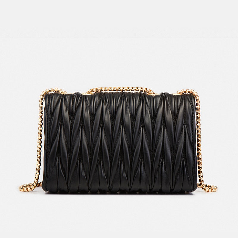 Sac à main femme noir et doré, bandoulière stylée, accessoire mode tendance. Idéal pour soirée élégante. En cuir.