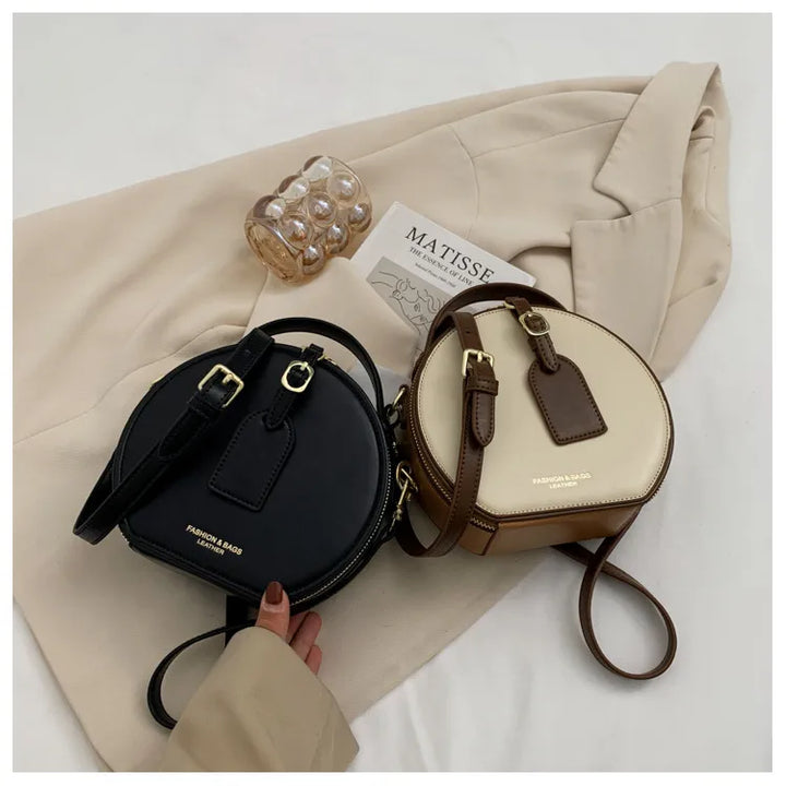 Sac bandoulière rond en cuir PU camel pour femme, style moderne et pratique.