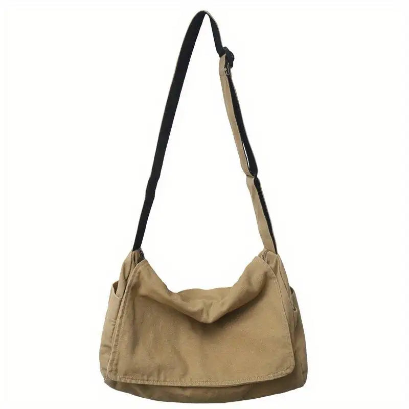 Vue de côté du sac bandoulière unisexe en toile écologique, élégant et fonctionnel pour la mode.