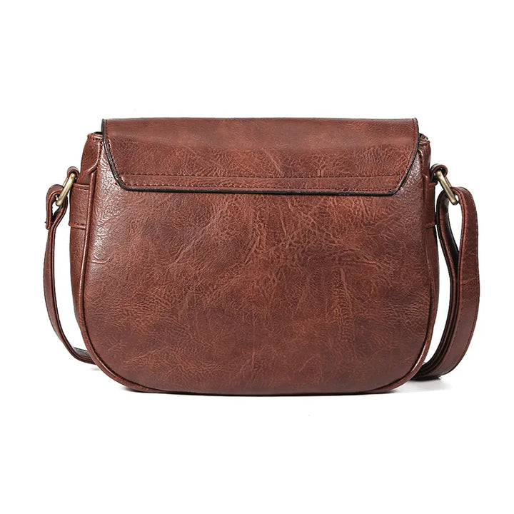 Élégant sac bandoulière en cuir pour femme, style rétro chic et intemporel.