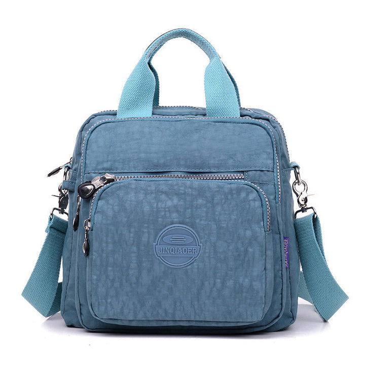 "Sac bandoulière femme imperméable 3-en-1, élégant, couleurs variées, design polyvalent, poches zippées, style chic."