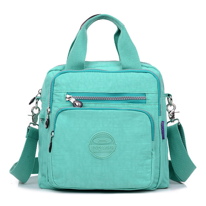 "Sac bandoulière femme imperméable 3-en-1, élégant, couleurs variées, design polyvalent, poches zippées, style chic."