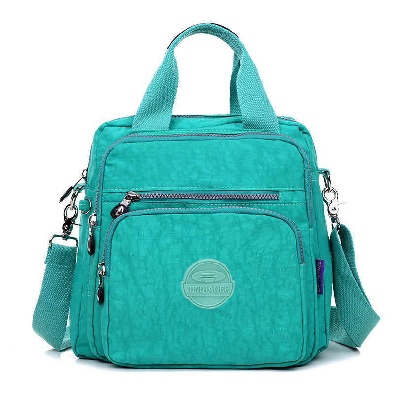 "Sac bandoulière femme imperméable 3-en-1, élégant, couleurs variées, design polyvalent, poches zippées, style chic."