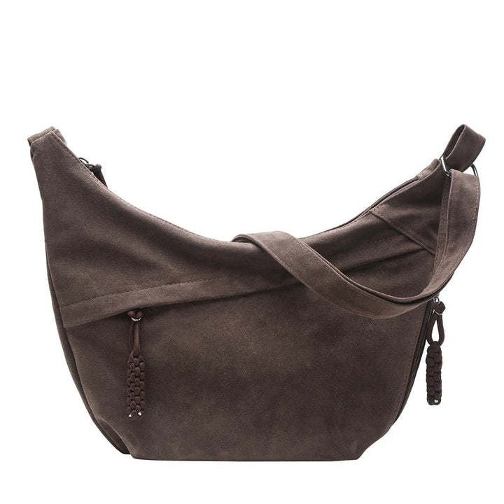 Magnifique sac besace femme en faux daim, un choix chic et respectueux de l'environnement.