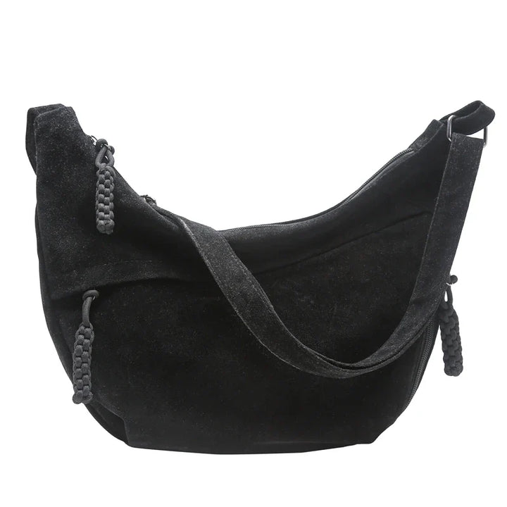 Sac besace femme en faux daim élégant, un accessoire tendance et intemporel.