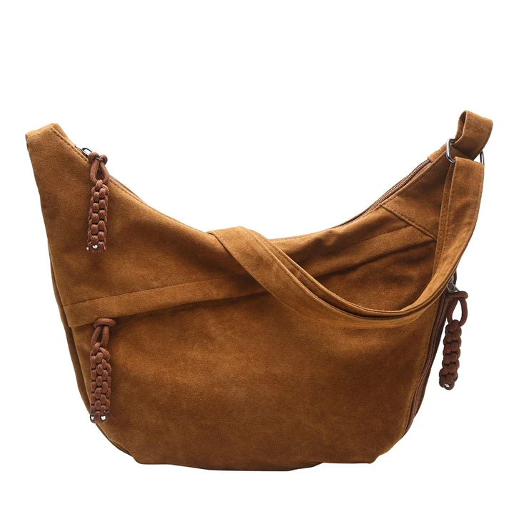 Sac à épaule hobo femme en faux daim synthétique, alliant douceur et élégance.