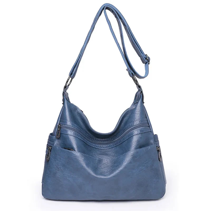 Sac besace femme élégant en similicuir souple, bandoulière, idéal accessoire mode quotidien.