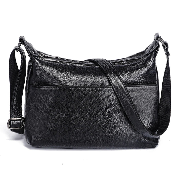 Détail du sac besace femme en cuir PU, bandoulière et couture de qualité, coloris rouge foncé