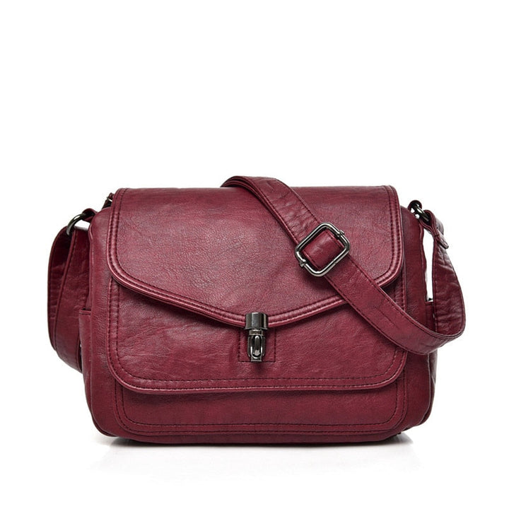 Sac besace en cuir PU pour femme, présenté de côté, un accessoire de mode fonctionnel.