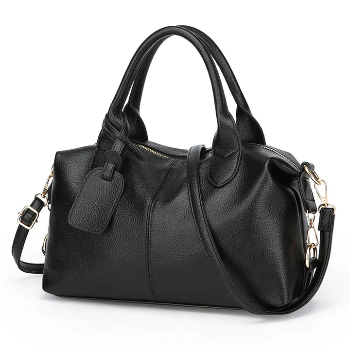 Élégant sac à main bowling noir pour femmes, design chic et spacieux en similicuir de haute qualité.