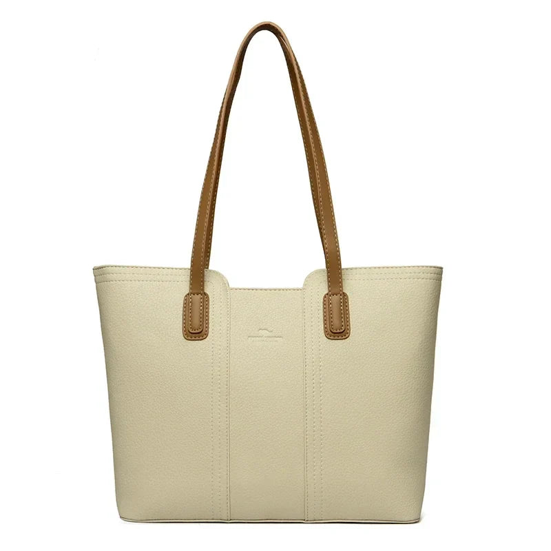 Sac à épaule chic en similicuir pour femme, style cabas, avec fermeture éclair, un accessoire mode élégant.