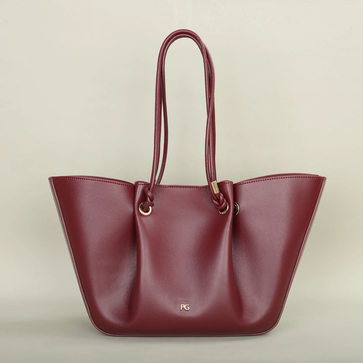 Sac à main cabas Colette en cuir vegan marron, porté à l'épaule, idéal pour le shopping féminin.