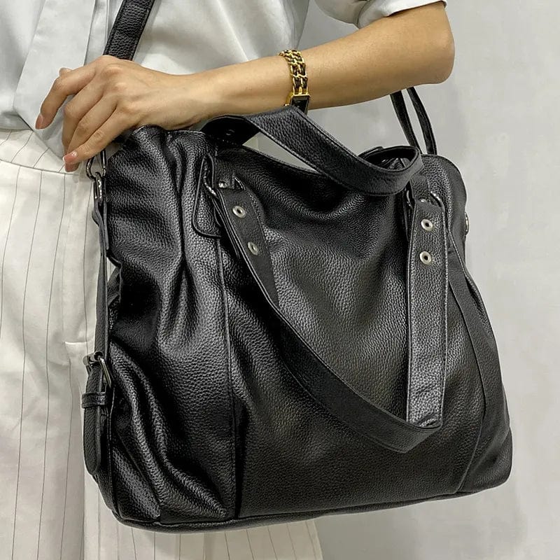 "Sac cabas en cuir PU souple noir, élégant et spacieux, avec fermeture zippée et bandoulière pour un style pratique."