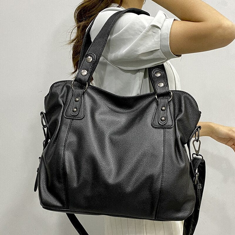 "Sac cabas en cuir PU souple noir, élégant et spacieux, avec fermeture zippée et bandoulière pour un style pratique."