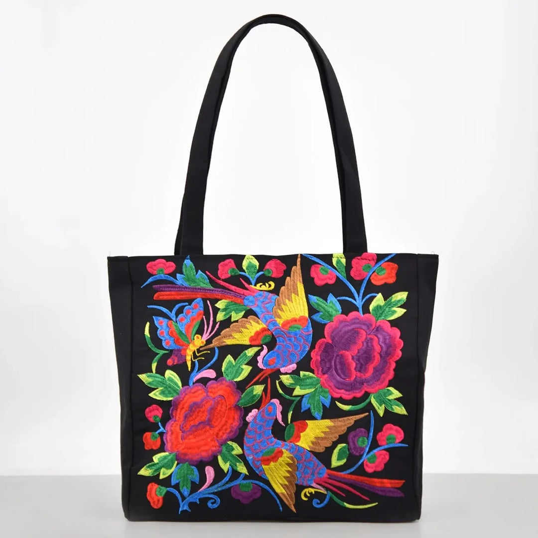 Sac cabas femme en tissu, broderies détaillées de fleurs et oiseaux colorés, accessoire grand et élégant.