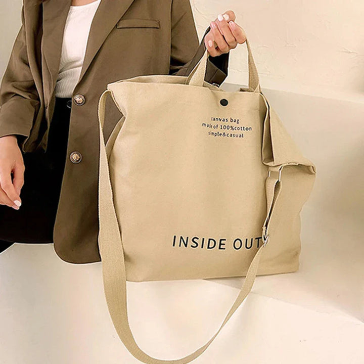 Grand sac cabas fourre-tout en toile blanche, robuste et pratique, parfait pour shopping ou plage.