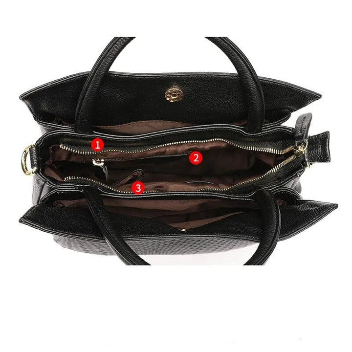 Sac cabas femme Alexandra en cuir rouge, posé sur une surface, avec ses poignées robustes et son design épuré.