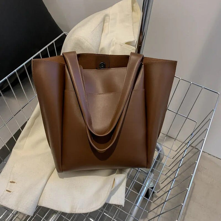 Sac cabas femme Ariel en cuir PU, bandoulière réglable, porté épaule, parfait pour look professionnel.