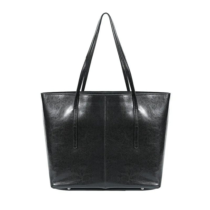 Sac cabas femme professionnel en cuir, bandoulière amovible, idéal pour le bureau et ordinateur.