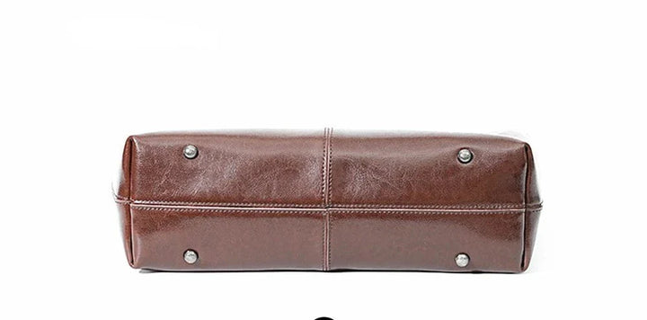 Sac à main cabas en cuir véritable pour femme, couleur bordeaux, design moderne pour ordinateur.