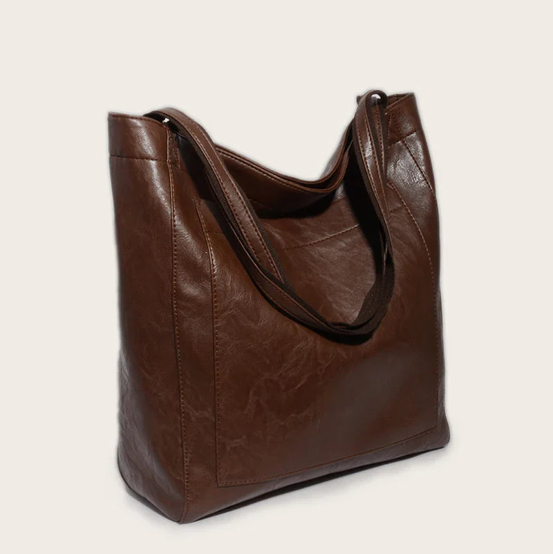 Sac cabas femme design minimaliste en cuir PU, chic et fonctionnel, pour un look soigné.